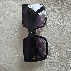 Black and gold sunglasses with case